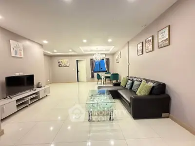 Spacious modern living room with elegant decor and open layout, perfect for relaxation and entertainment.