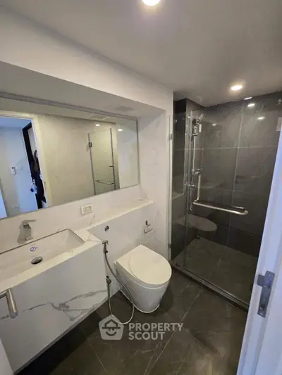 Modern bathroom with sleek design and glass shower enclosure