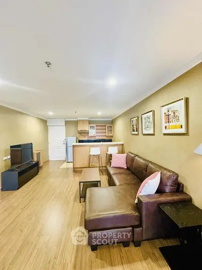 Spacious modern living room with open kitchen and stylish decor