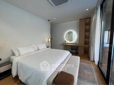 Luxurious modern bedroom with king-size bed, stylish decor, and natural light from large windows.