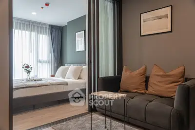 Modern apartment interior with cozy living room and elegant bedroom, featuring stylish decor and natural light.