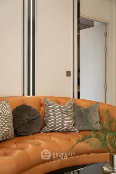 Luxurious modern living room with stylish leather sofa and decorative pillows