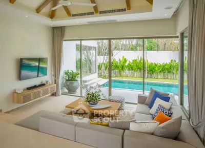 Luxurious living room with pool view, modern decor, and large windows in a stunning villa.