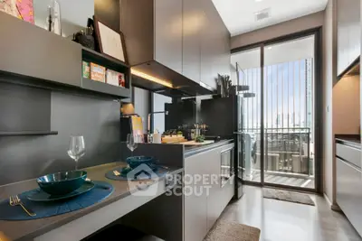 Modern kitchen with sleek cabinetry and balcony view, perfect for urban living.