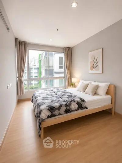 Modern bedroom with large window and stylish decor in urban apartment