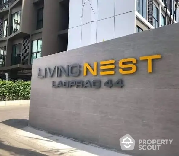 Modern apartment building exterior with Living Nest signage at Ladprao 44.