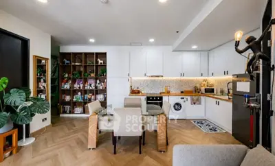 Modern open-layout kitchen and dining area with stylish decor and appliances.