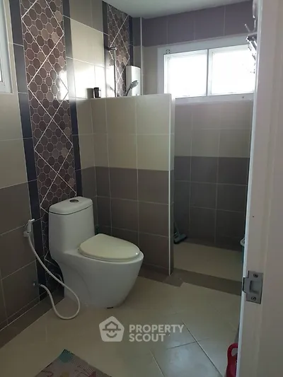 Modern bathroom with stylish tiles and natural light