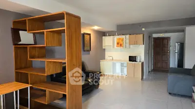Spacious living room with modern open kitchen and stylish wooden shelving