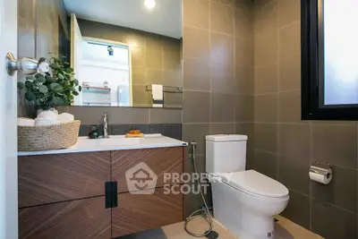 Modern bathroom with sleek fixtures and stylish wooden vanity