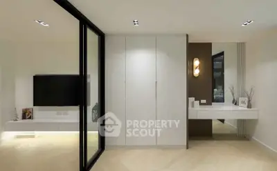 Modern minimalist living room with sleek design and elegant lighting