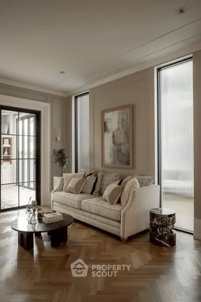 Elegant living room with herringbone wood flooring and stylish decor