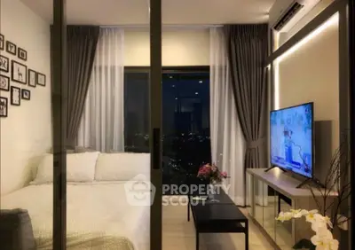 Modern bedroom with city view, stylish decor, and ambient lighting.