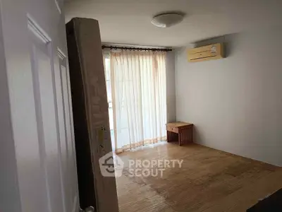 Cozy bedroom with natural light and air conditioning