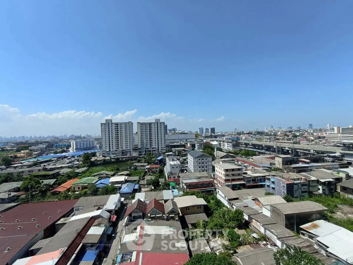 Stunning cityscape view showcasing diverse architecture under a clear blue sky, perfect for urban living enthusiasts.