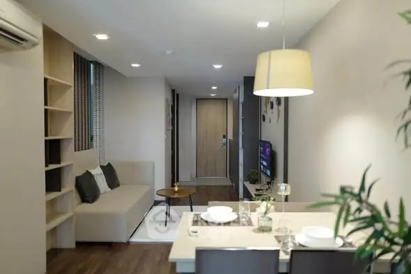 Modern living room with dining area in stylish apartment
