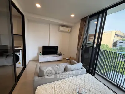 Modern living room with balcony view and sleek furniture