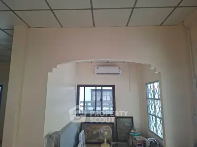 Cozy room with air conditioning and decorative wall art, ideal for a comfortable living space.