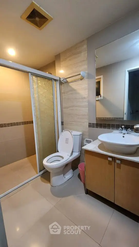 Modern bathroom with glass shower and stylish vanity