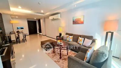 Spacious modern living room with elegant decor and cozy seating area in a stylish apartment.