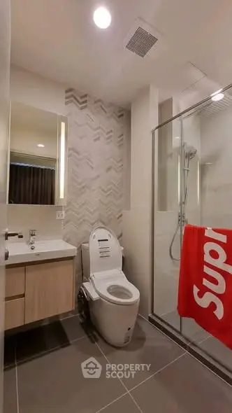 Modern bathroom with sleek design and glass shower enclosure