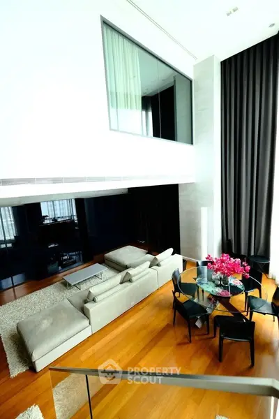 Luxurious modern living room with high ceilings and elegant decor