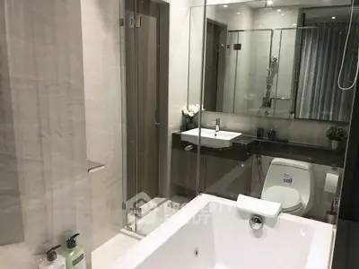Luxurious modern bathroom with sleek fixtures and elegant design.