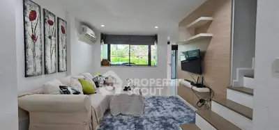 Stylish living room with modern decor and large window view