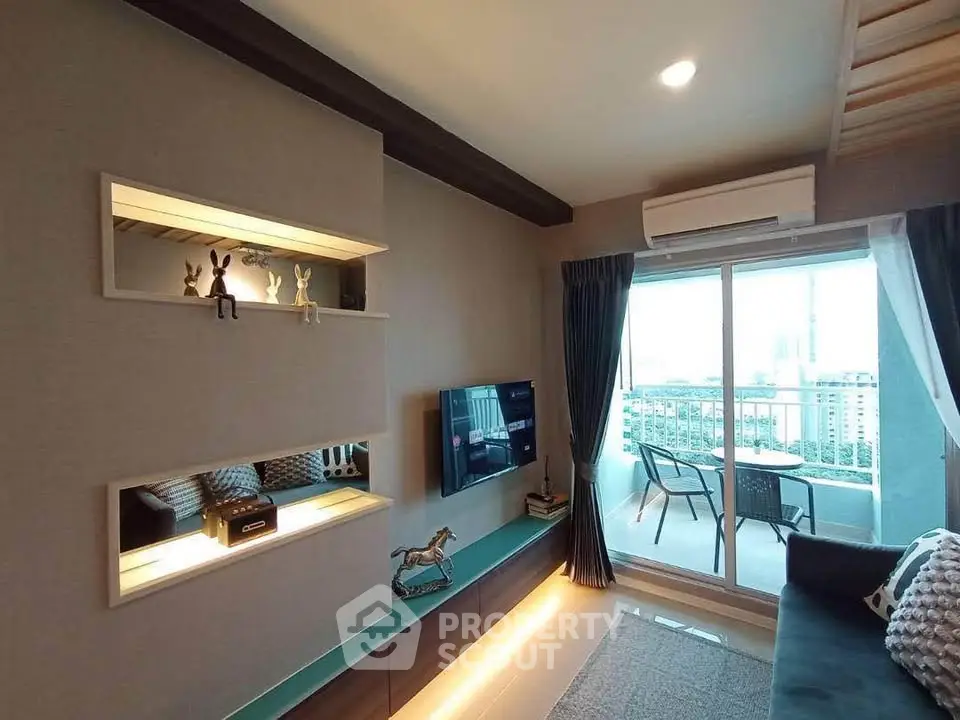 Modern living room with balcony and city view, featuring stylish decor and natural light.