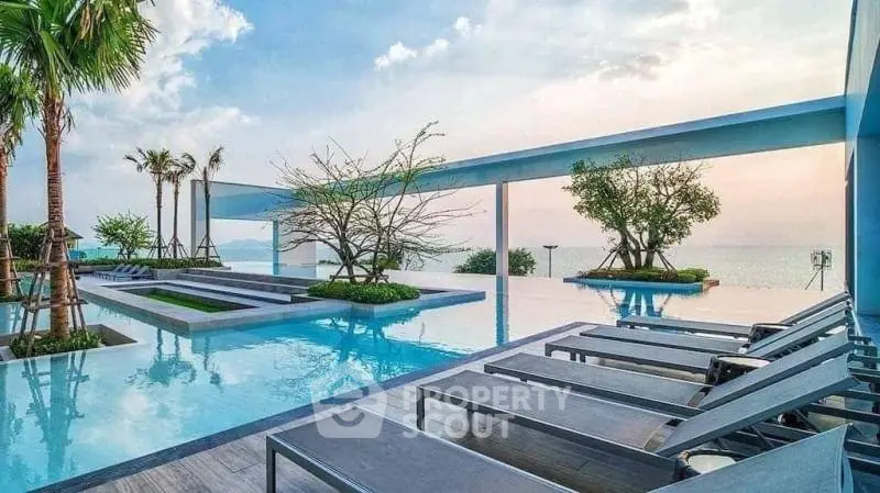 Luxurious rooftop pool with stunning ocean view and modern lounge chairs