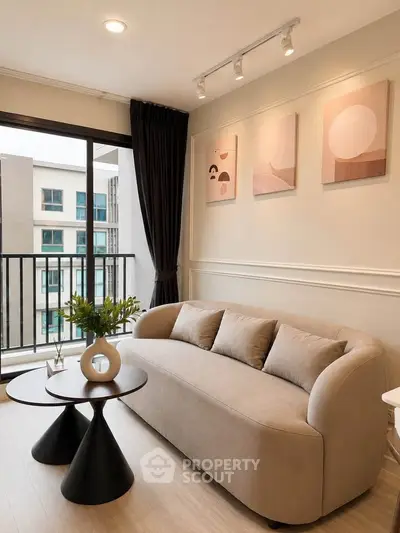 Stylish living room with modern sofa and balcony view in contemporary apartment