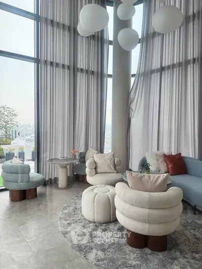 Luxurious modern living room with high ceilings and panoramic city views
