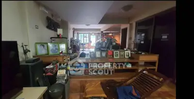 Spacious living room with eclectic decor and ample natural light