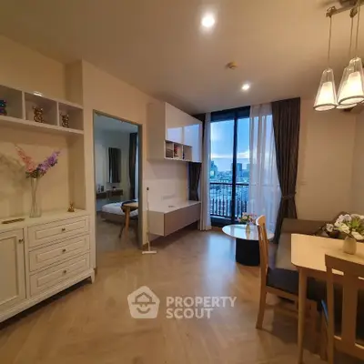 Modern living room with dining area and city view balcony