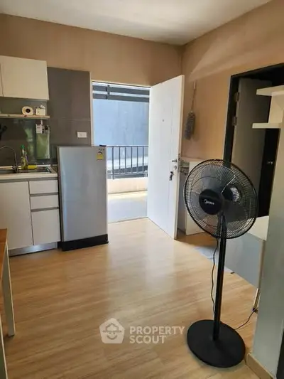 Modern kitchen with open layout and sleek appliances in a cozy apartment