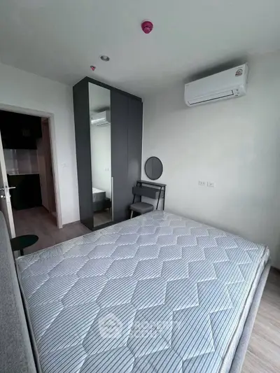 Modern bedroom with air conditioning and stylish furniture in a contemporary apartment.