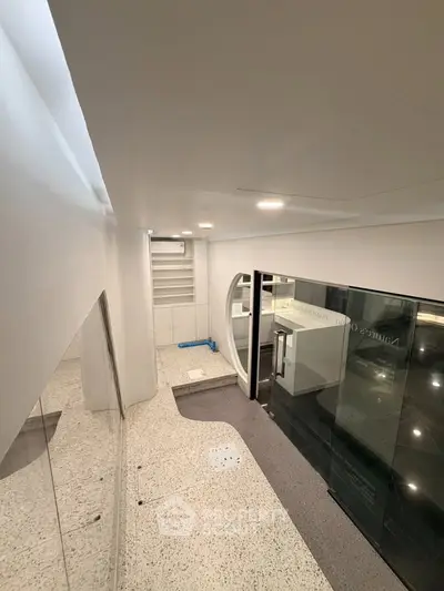 Modern commercial space with sleek design and glass partitions