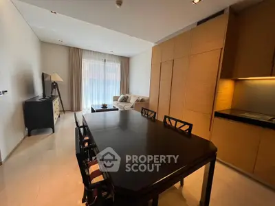 Spacious modern living room with dining area and elegant furnishings in a contemporary apartment.