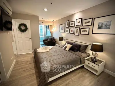 Cozy bedroom with stylish decor and balcony view in modern apartment