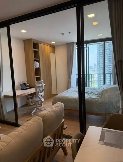 Modern apartment with spacious bedroom and city view, featuring a cozy study area and elegant furnishings.