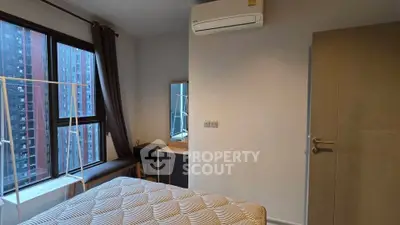 Cozy bedroom with city view and modern furnishings