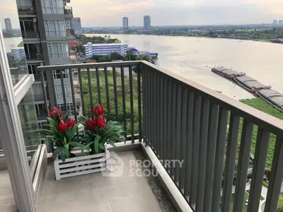 Stunning balcony view overlooking river and cityscape, perfect for relaxation and enjoying sunsets.