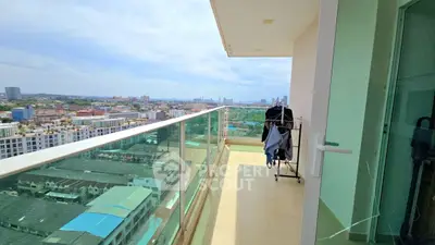 Spacious balcony with stunning city view in modern high-rise apartment