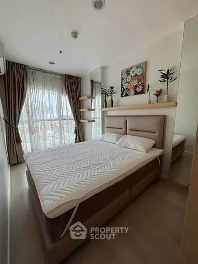 Cozy modern bedroom with large window and stylish decor