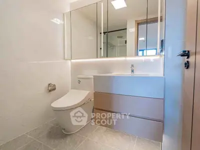 Modern bathroom with sleek fixtures and ample storage space