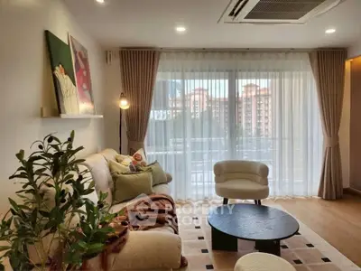 Stylish living room with modern decor and large window view