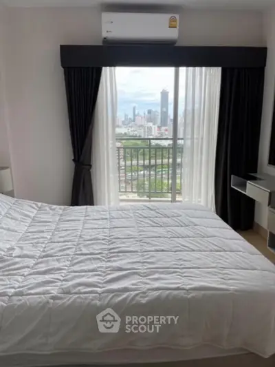 Cozy bedroom with city view from balcony, featuring modern air conditioning and elegant curtains.