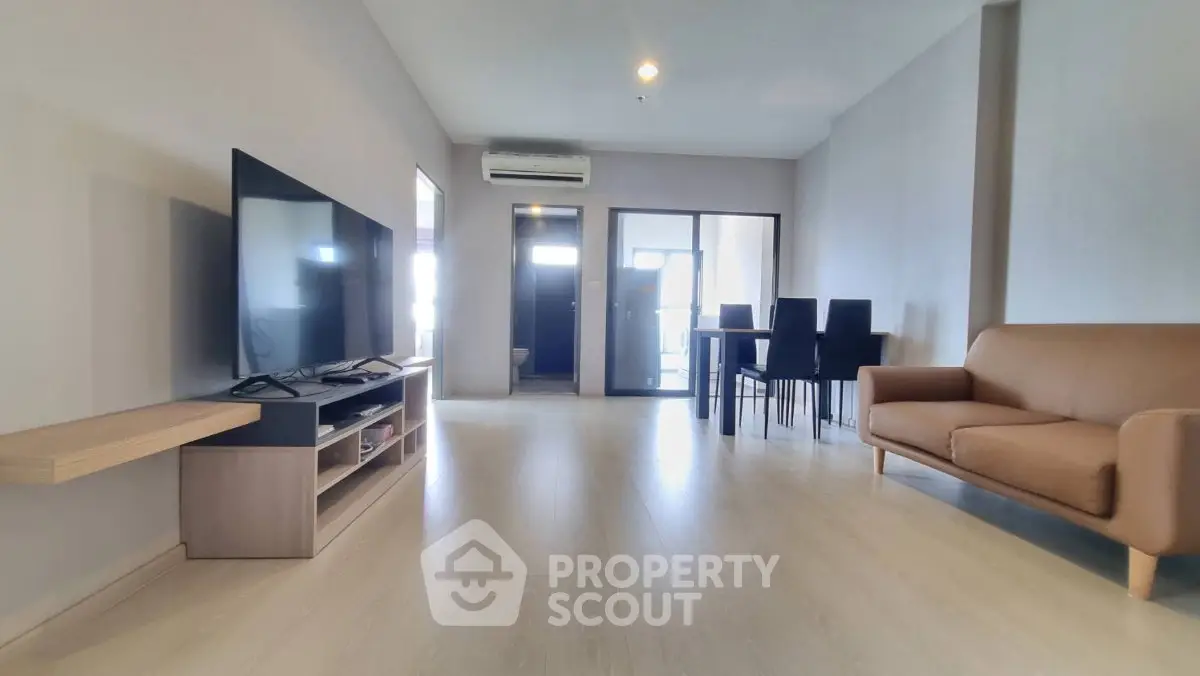 Spacious modern living room with sleek furniture and natural light