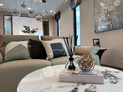 Stylish modern living room with elegant decor and cozy seating area.