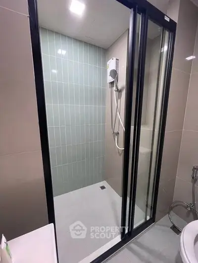 Modern bathroom with sleek shower enclosure and contemporary fixtures